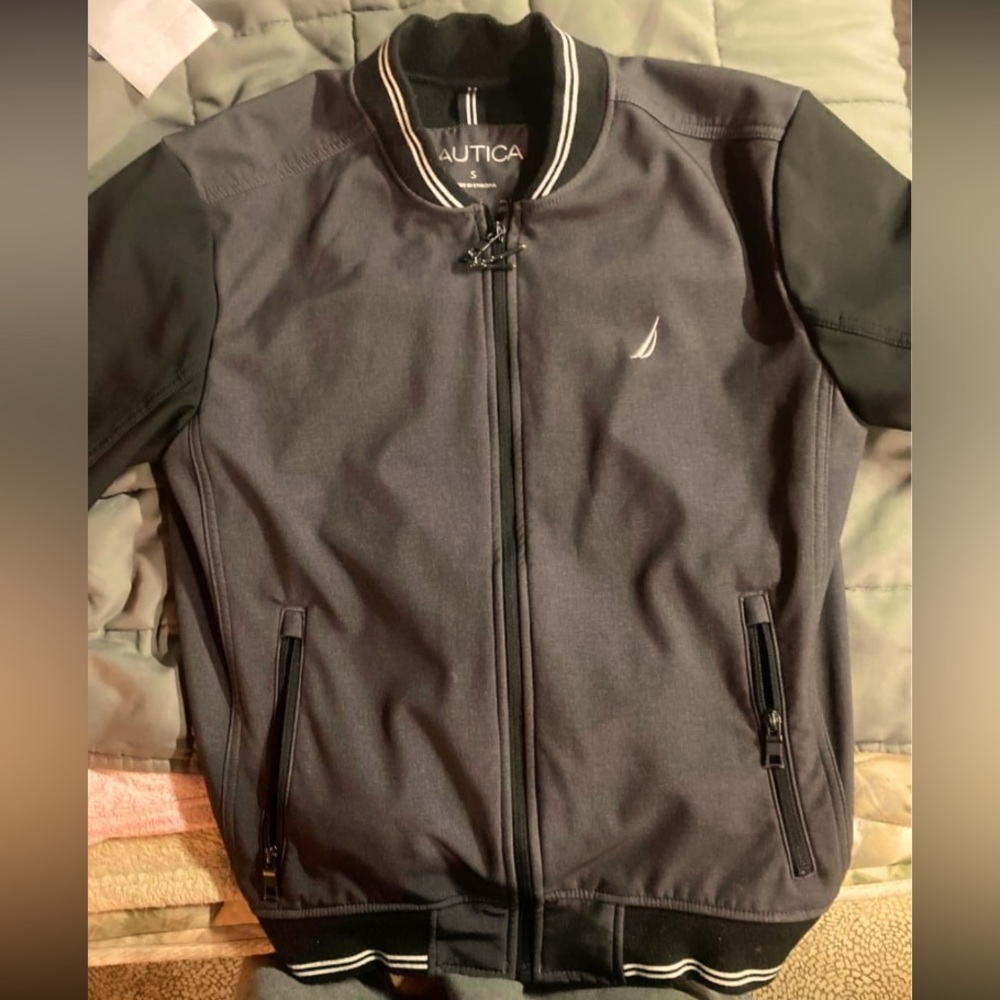 Nautica (small) water and wind resistant never worn bought wrong size.  Jacket